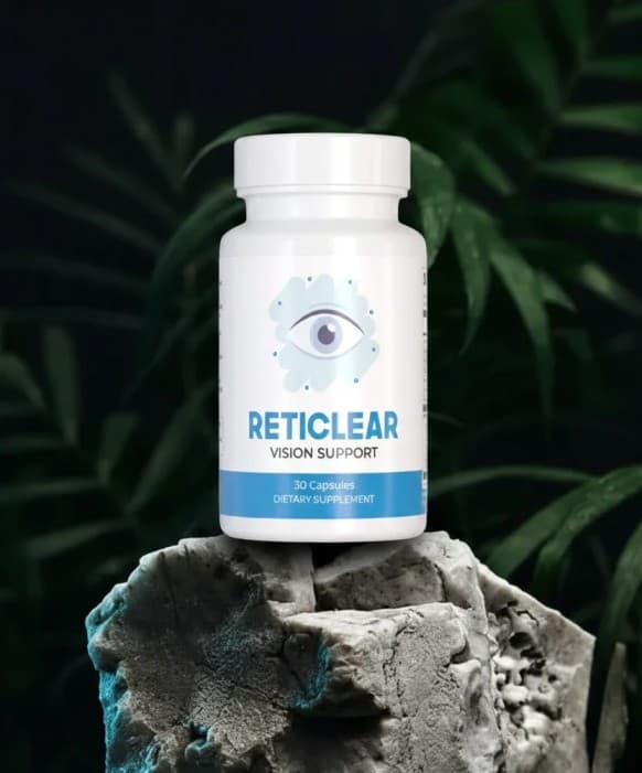 Reticlear Vision Support bottle on a textured rock with dark green tropical leaves behind.